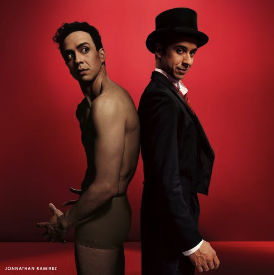 2 male presenting dancers in costumes for Jekyll & Hyde stand back to back