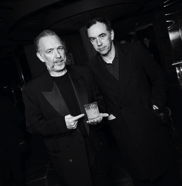 2ManyDJs pose in a black and white photo, one holding a scotch glass