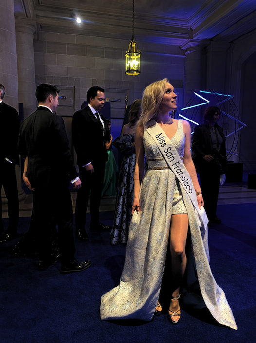 miss san francisco poses in a long, white gown