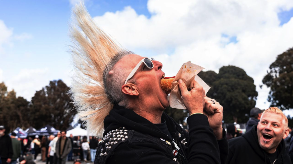 mohawked Jason Fedor deep throatin' a hot dog