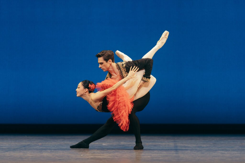 Madeline Woo performing Kitri in Don Quixote ballet at San Francisco Ballet in a lifted arabesque with partner