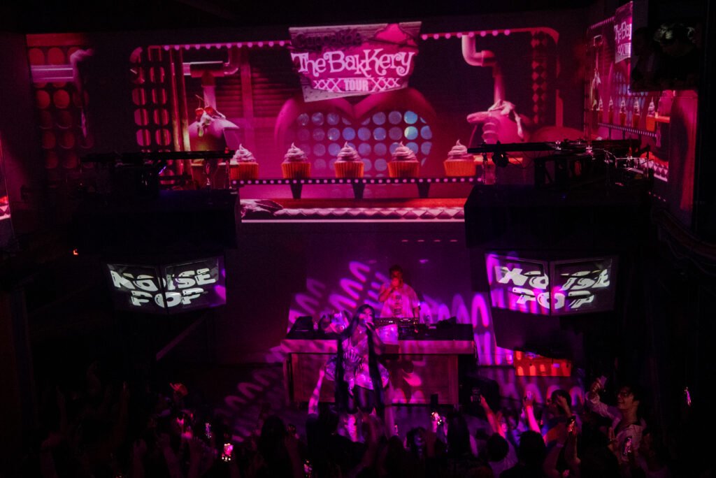 CupcakKe performing under pink lighting during Noise Pop Festival concert in San Francisco