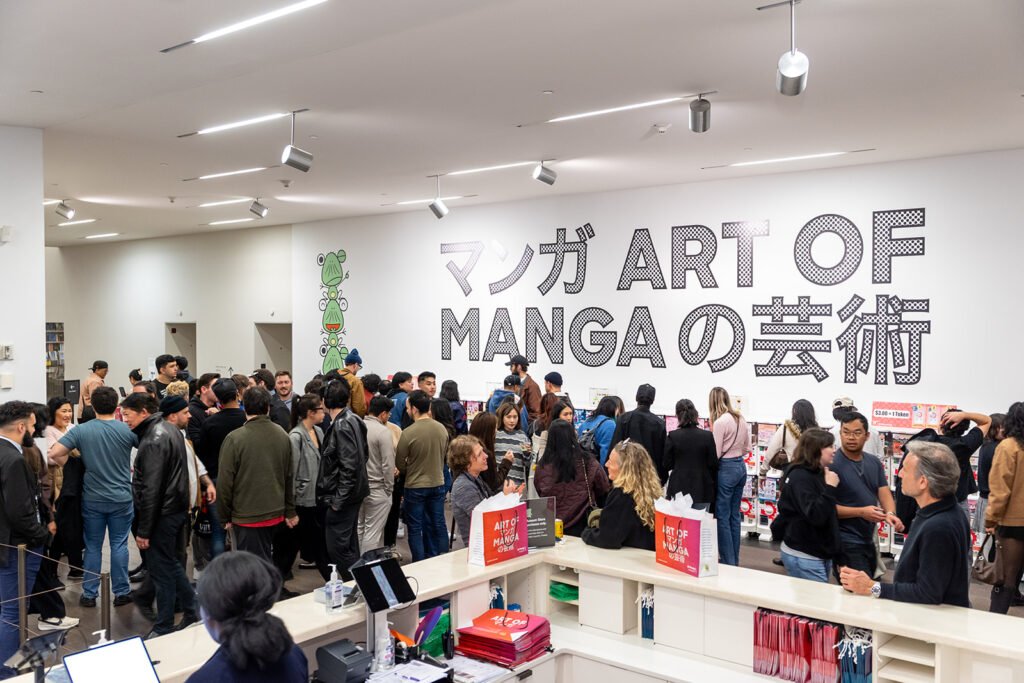 Visitors exploring the Art of Manga exhibition at the de Young Museum in San Francisco