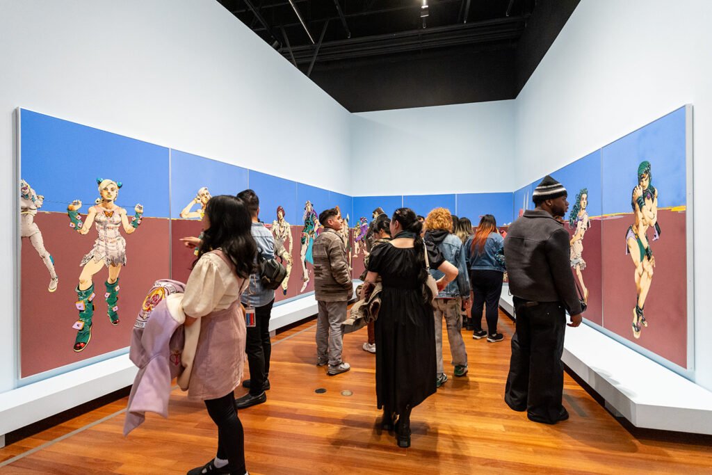 Museum visitors viewing manga inspired artwork during Late Night Editions Art of Manga