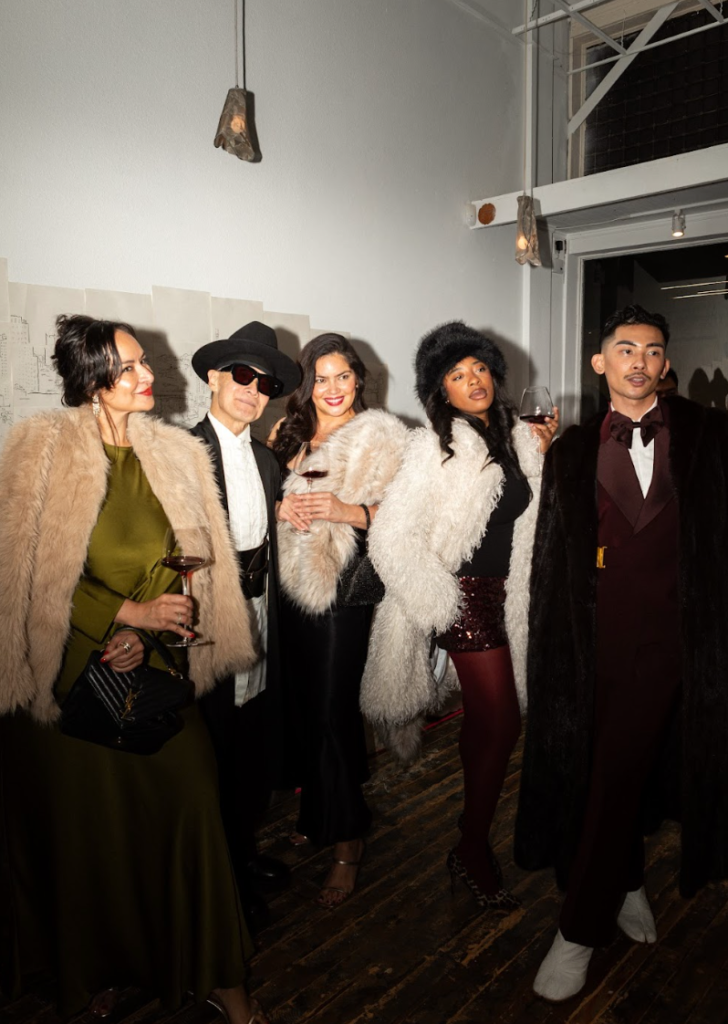 Guests wearing fur coats and eveningwear gathered during the Haute Mess winter solstice fashion party in San Francisco