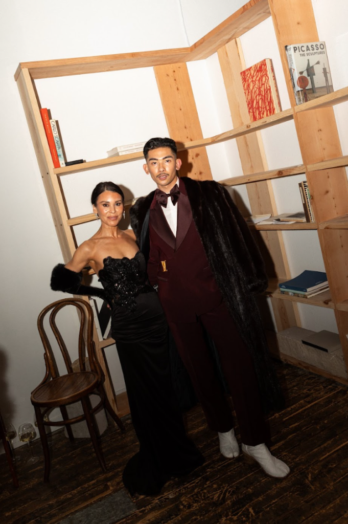 Guests in formal eveningwear posing at the Haute Mess winter solstice fashion gathering in San Francisco