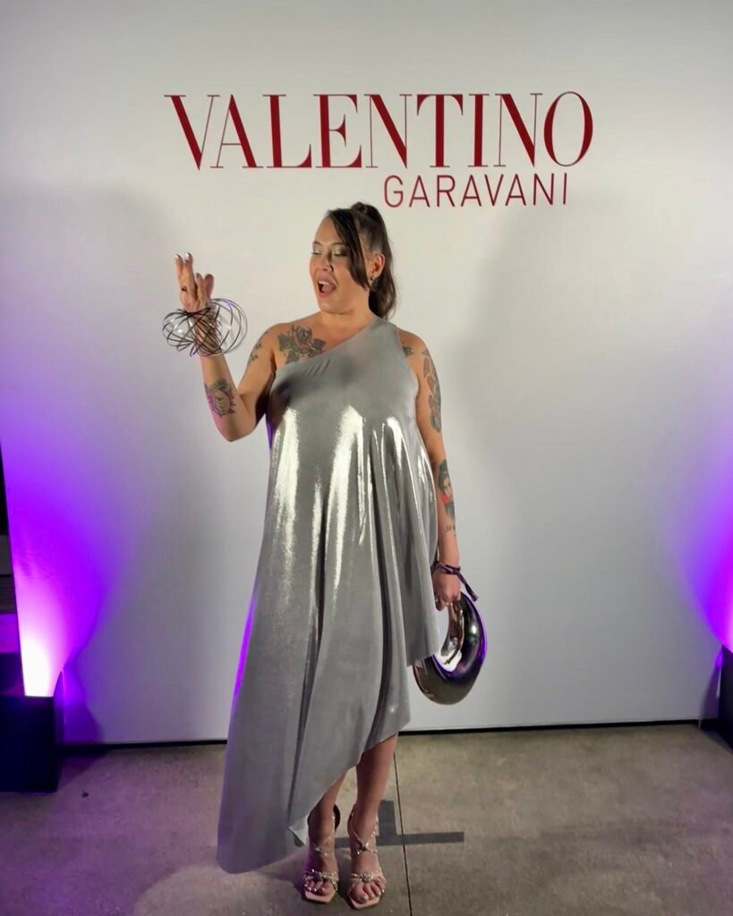 Guest in a silver one shoulder metallic Valentino dress at SFMOMA Art Bash