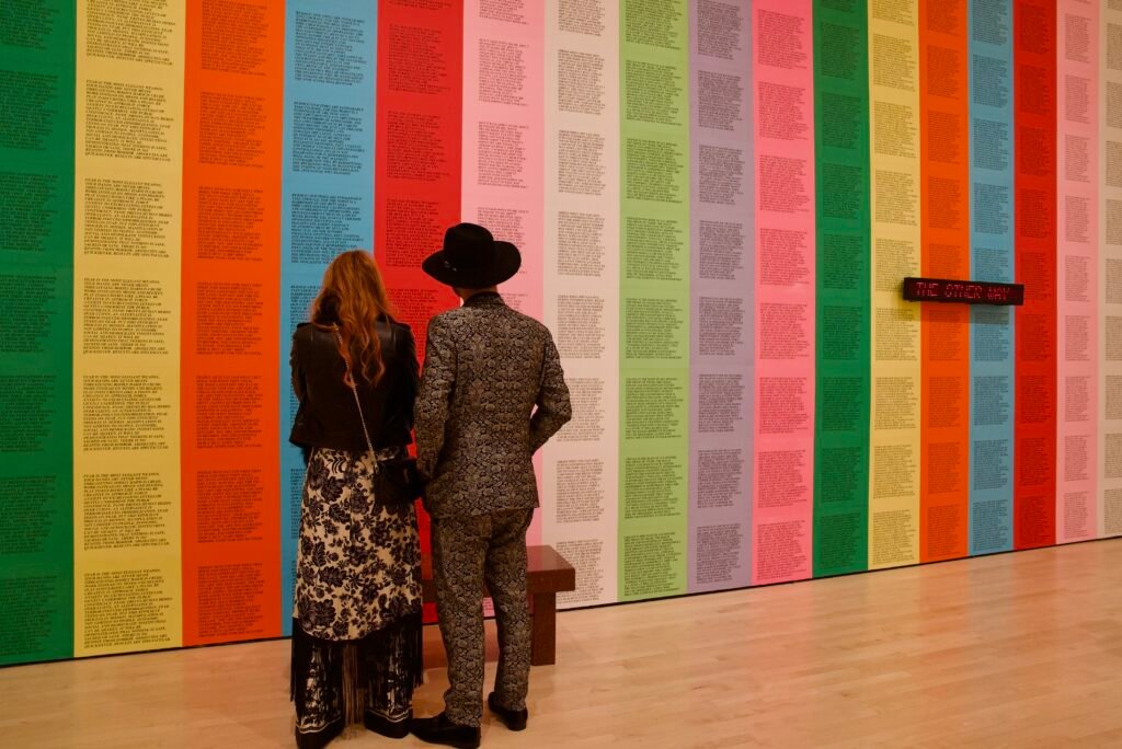 Couple viewing colorful text-based installation at SFMOMA Art Bash
