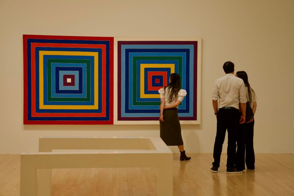 Guests viewing colorful geometric artwork at SFMOMA Art Bash
