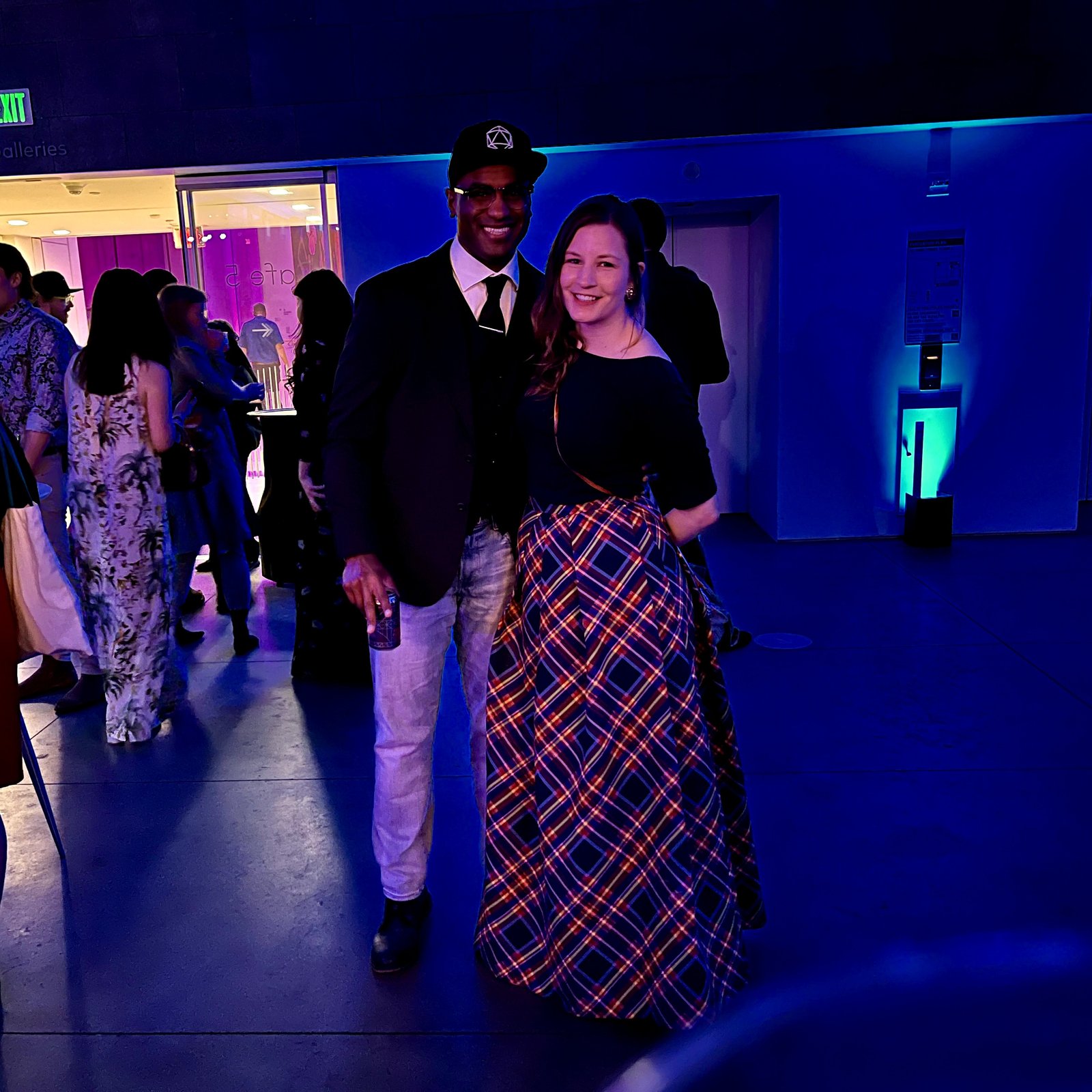 Couple in mixed casual and formal outfits at SFMOMA Art Bash