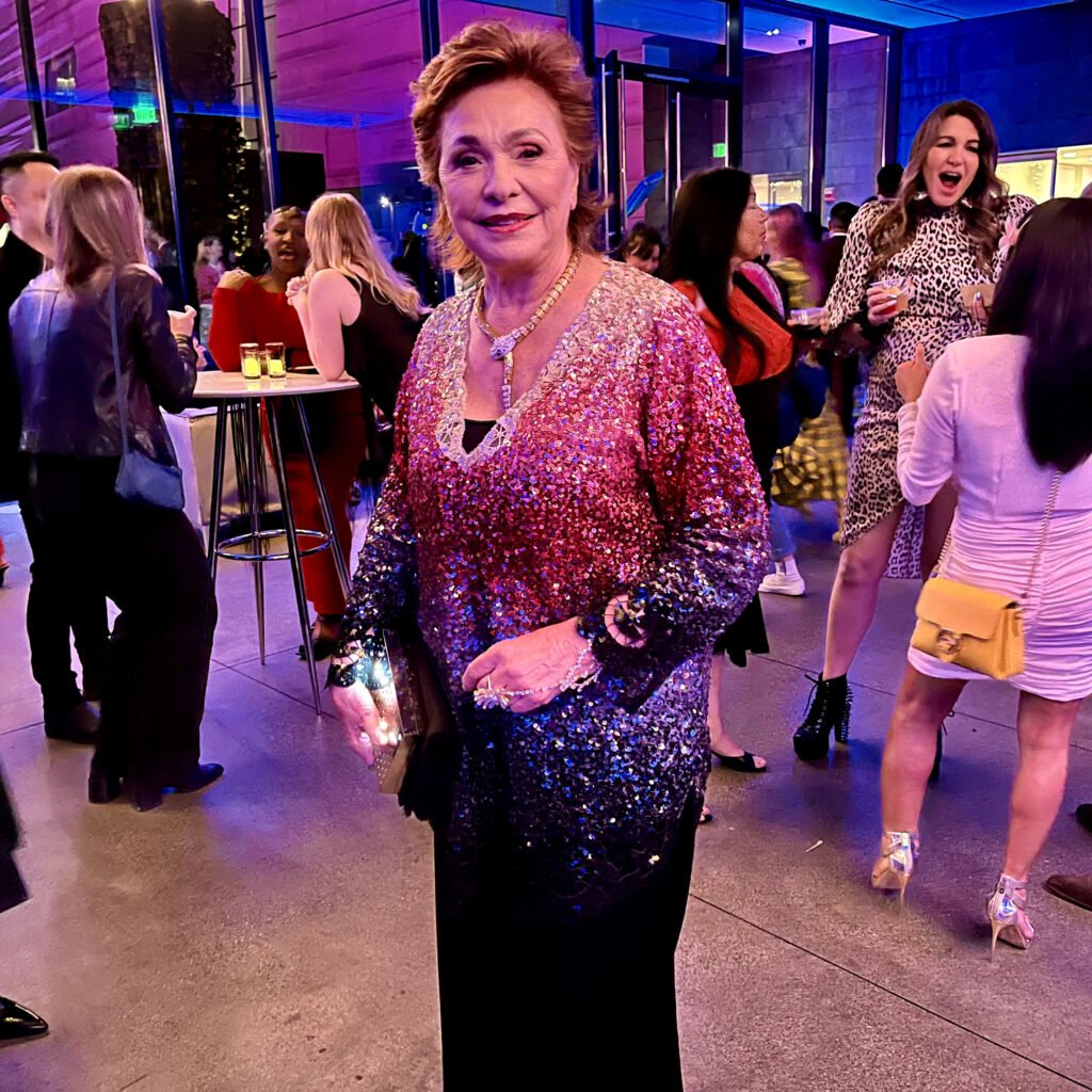 Guest wearing multicolor sequin dress at SFMOMA Art Bash party