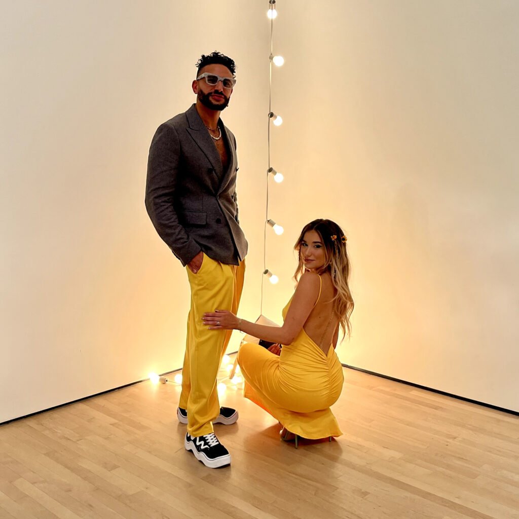 Couple wearing coordinated yellow outfits at SFMOMA Art Bash