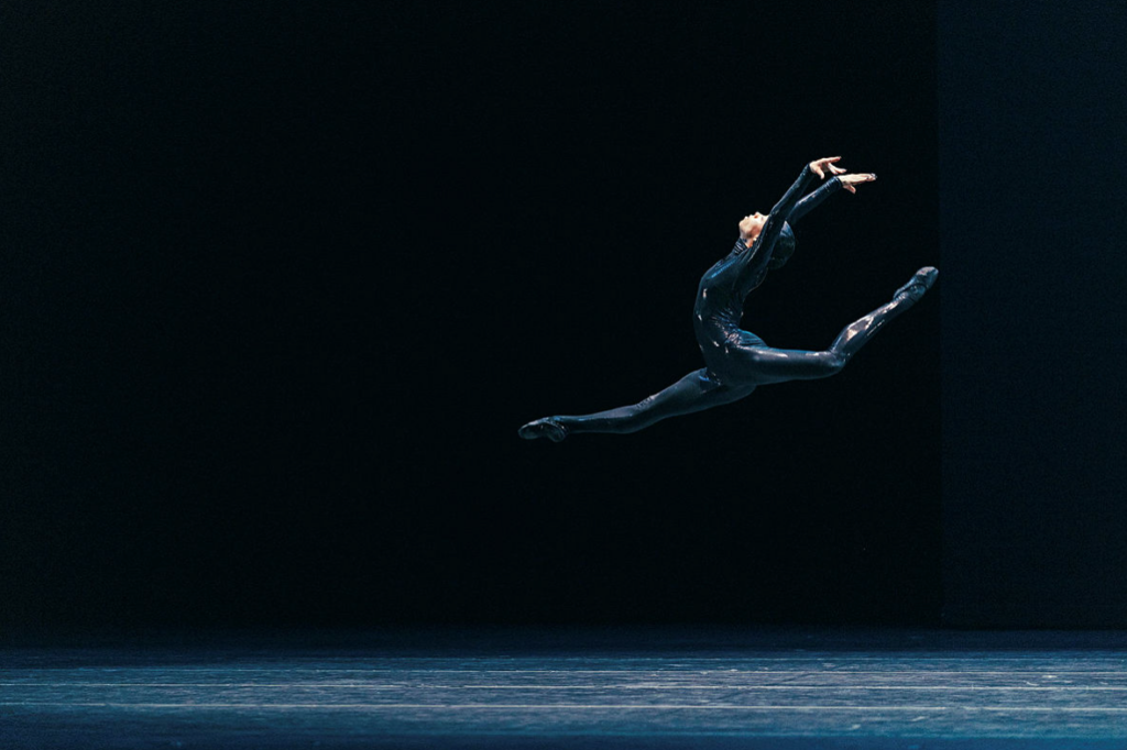 Nikisha Fogo contorted on the floor expressing pain and intensity in Mere Mortals