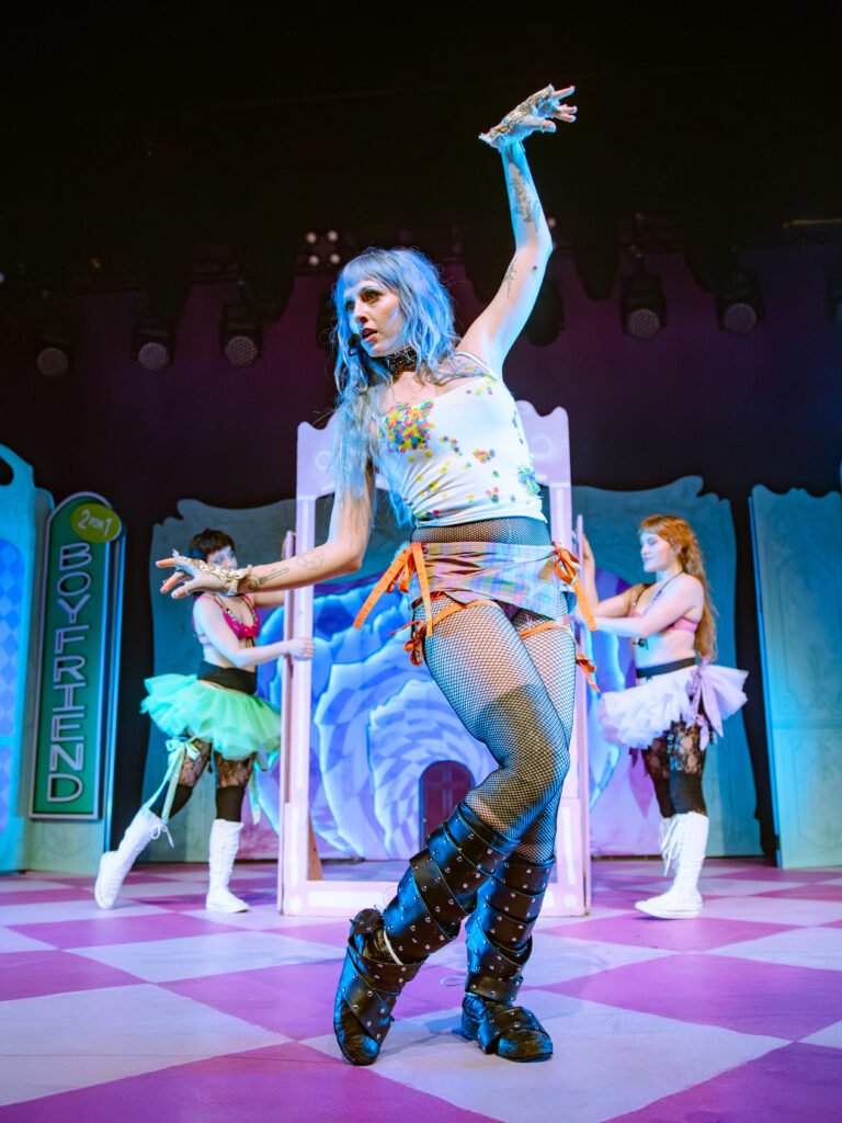 Ashnikko dancing on stage with colorful set design at The Warfield