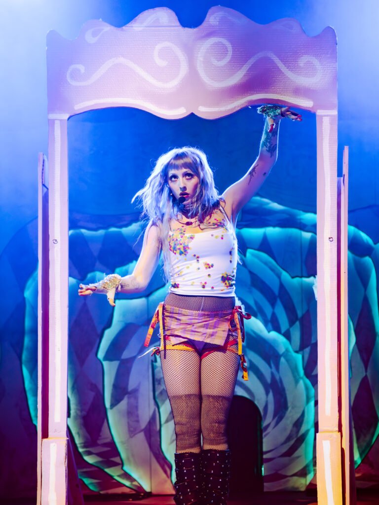 Ashnikko standing inside stage prop frame during live performance San Francisco