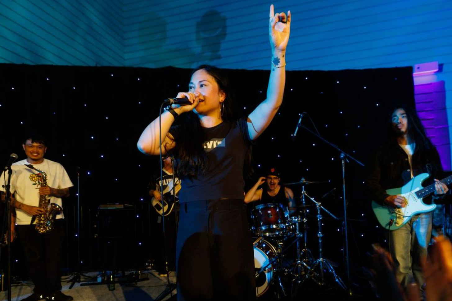 Ruby Ibarra performing live at Art Bash 2026 at SFMOMA with band on stage