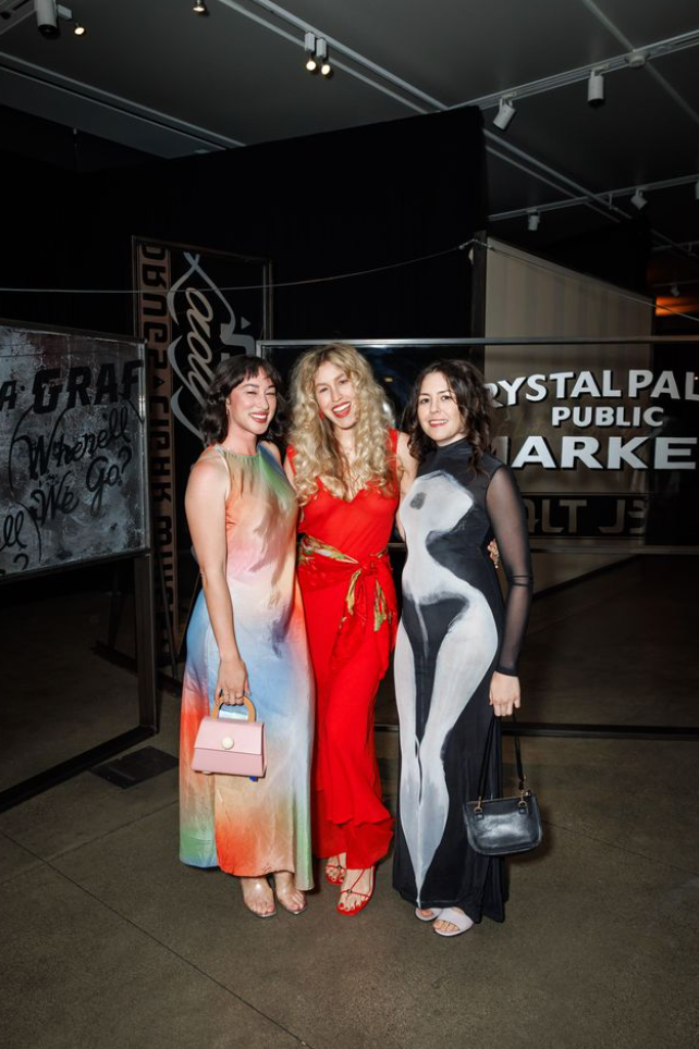 Three guests posing at Art Bash 2026 at SFMOMA wearing colorful and formal dresses