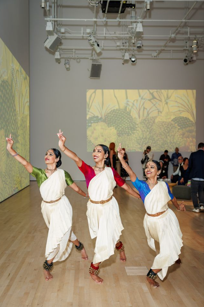 Three dancers performing at Art Bash 2026 at SFMOMA in traditional attire inside gallery