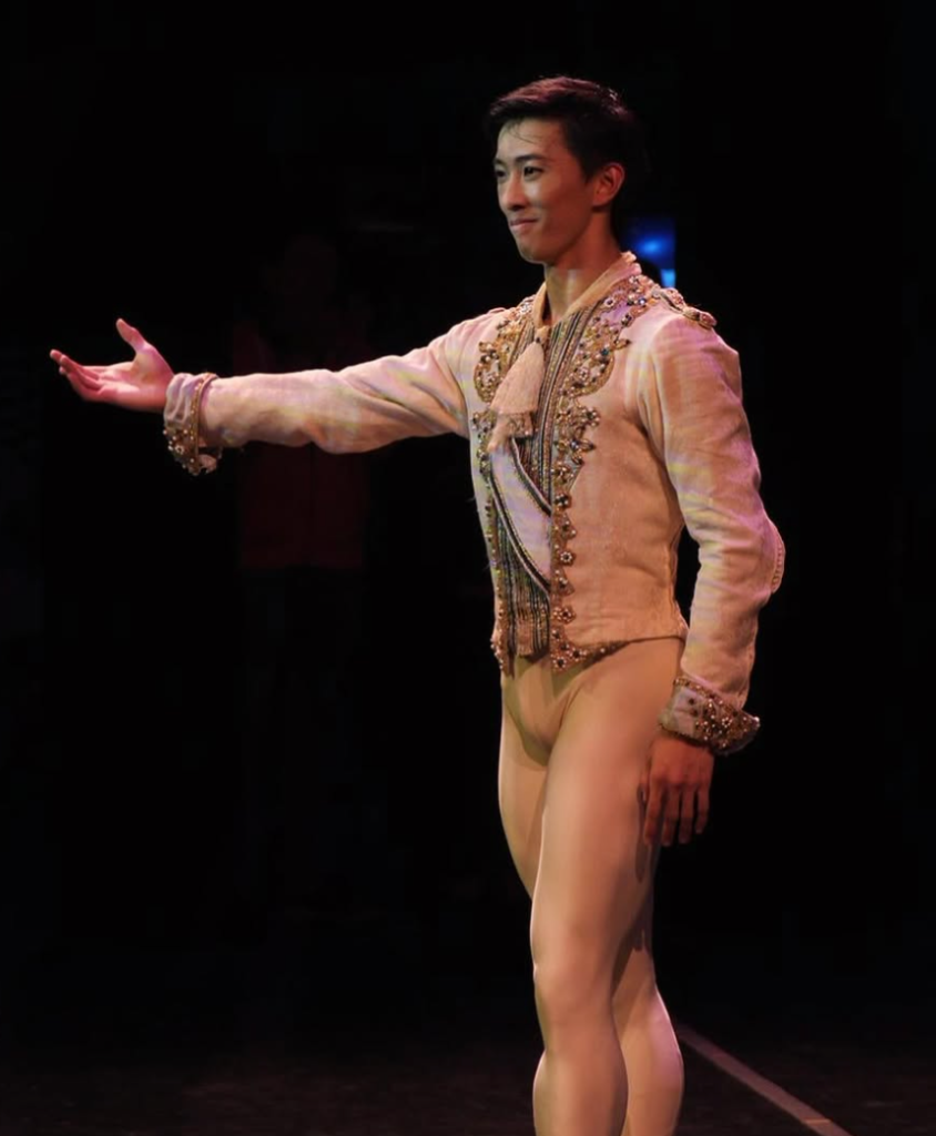 Wei Wang, principal dancer with San Francisco Ballet, stands onstage in costume during a performance